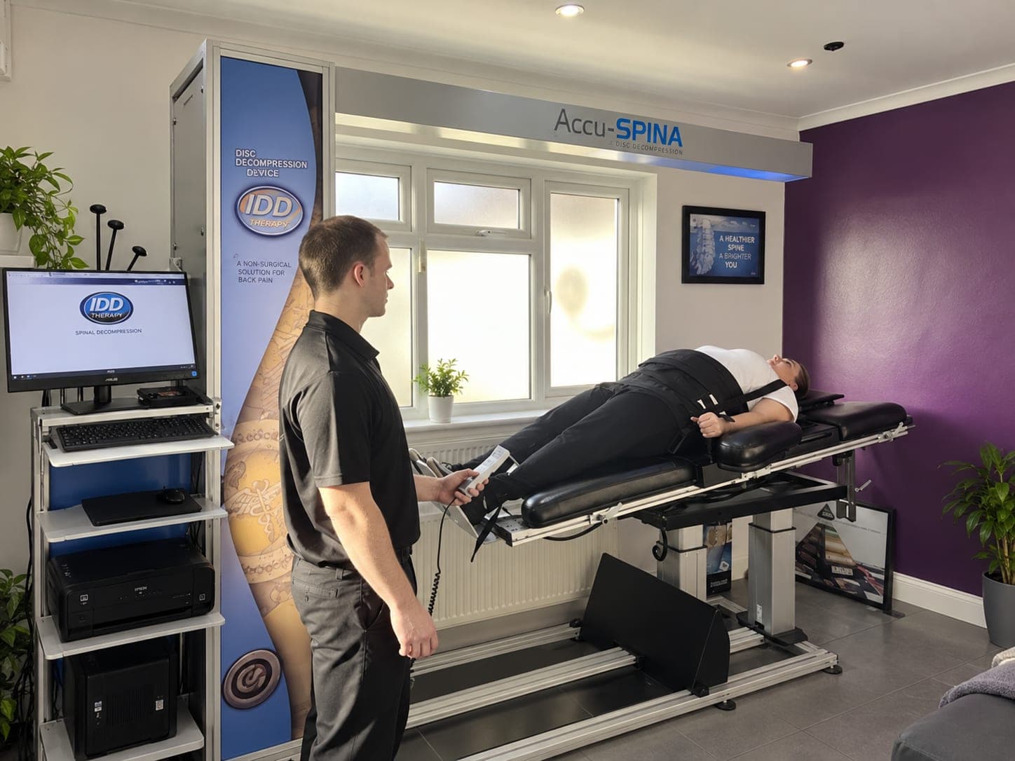 The IDD Therapy spinal decompression machine in the treatment room at Enfield Chiropractic Clinic